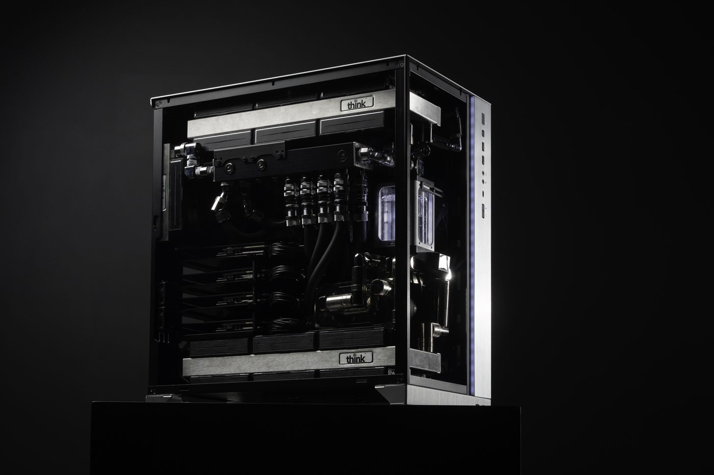 Think SuperNode in three-quarter view with the side panel open, showing the liquid cooling loop